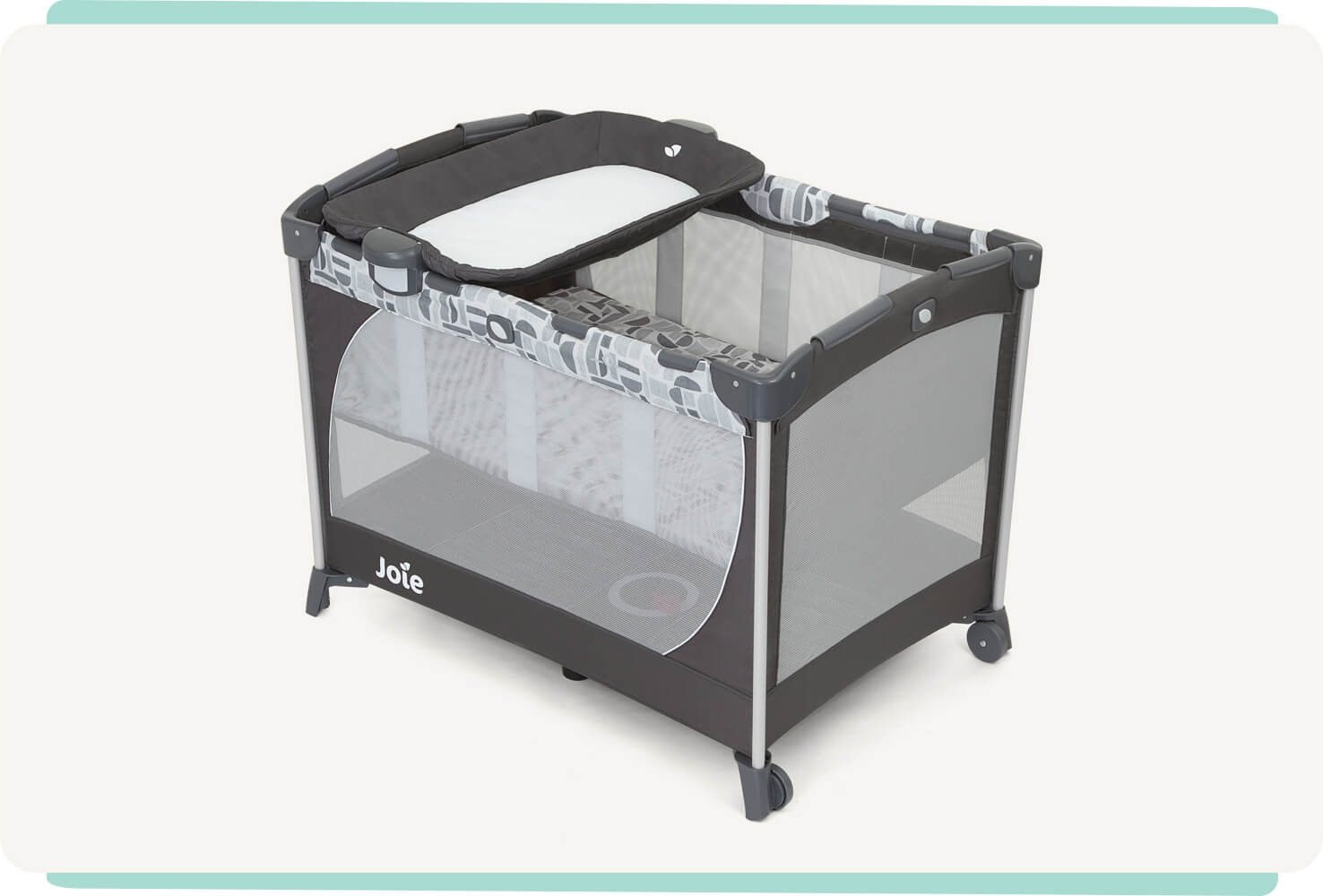 The Joie travel cot commuter change in grey and blue pattern with a bassinet and changer at a right angle.