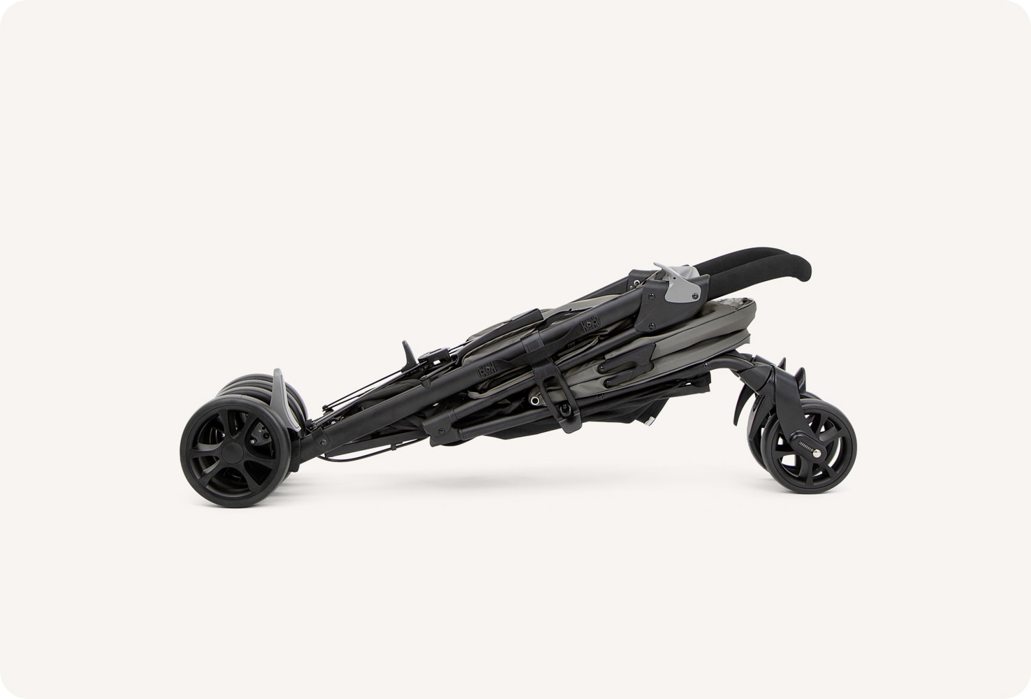  A folded Joie Brisk LX stroller in gray.
