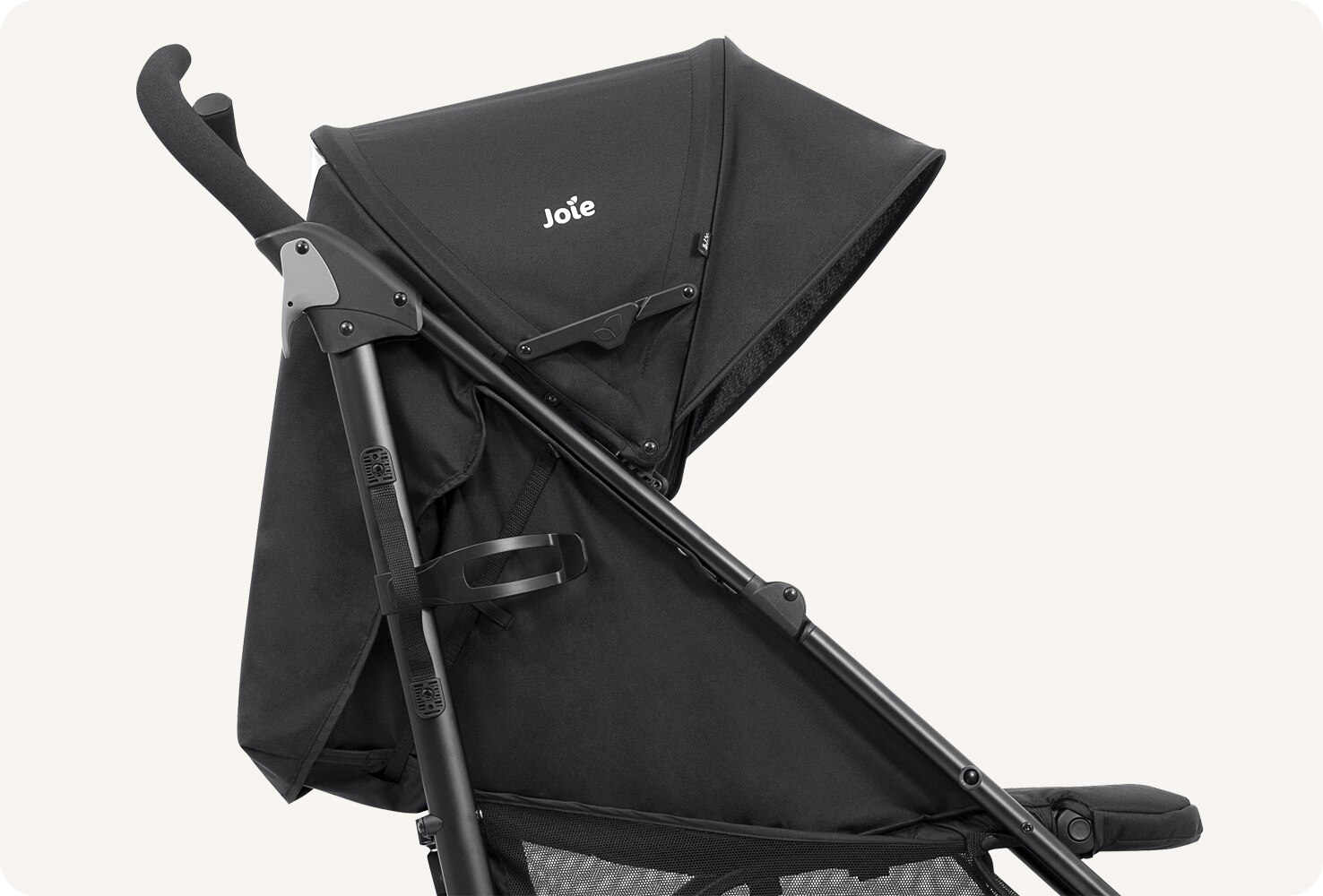 The Joie Brisk stroller in black facing right and reclined. 
