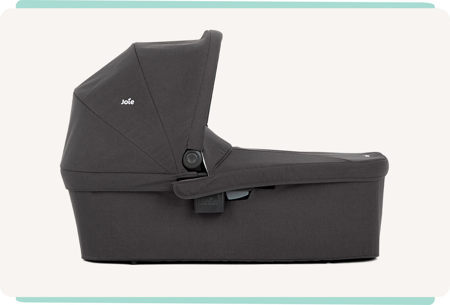   Black Joie Ramble XL carry cot in profile facing to the right.