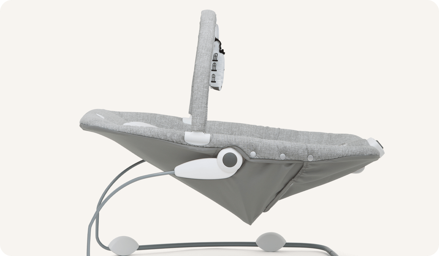   Side view of Joie light gray wish bouncer, reclined.