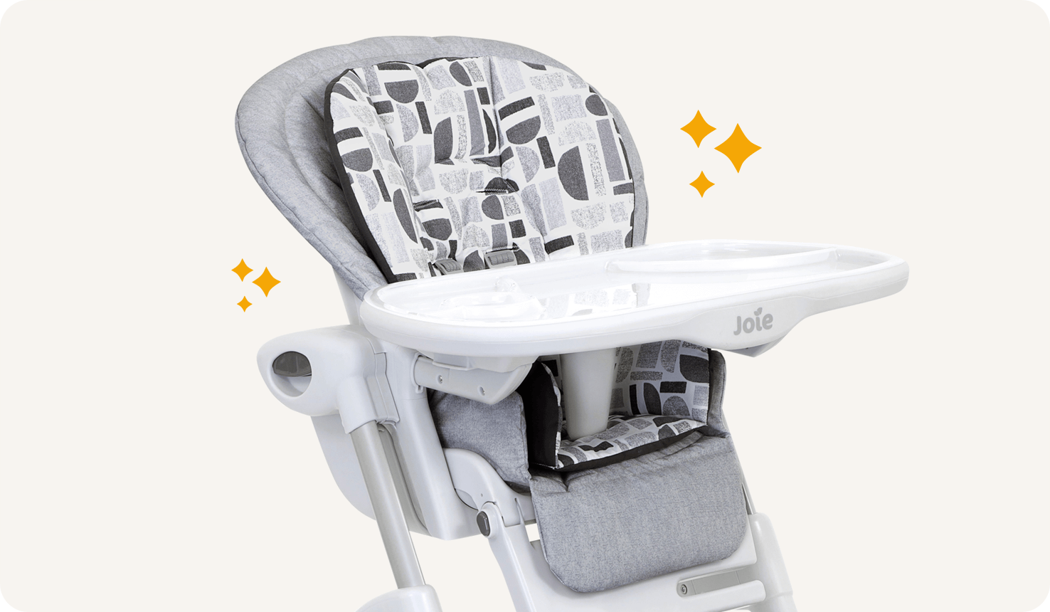 Gros plan sur une chaise haute 2-en-1 Mimzy, coloris à motifs gris/noir/blanc, avec icônes d’étoiles orange de chaque côté.