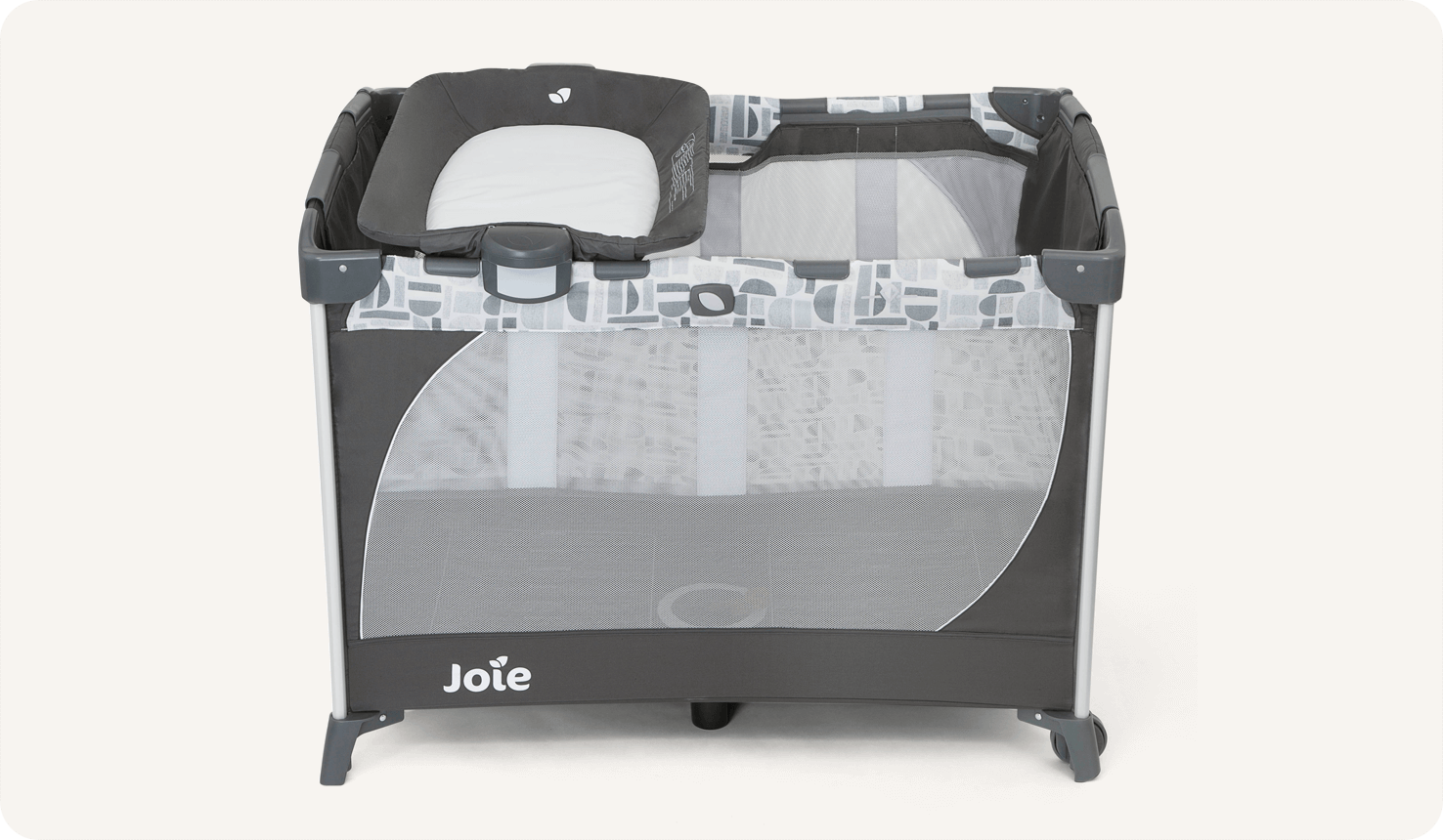 The Joie travel cot commuter change in grey and blue pattern with a bassinet and changer at side and top view.
