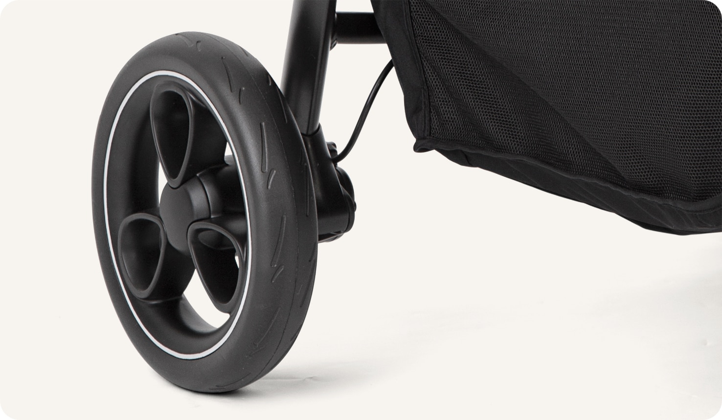Joie litetrax 4 stroller in gray close-up of puncture proof tyre.