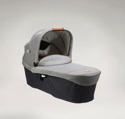 Joie Signature ramble xl carry cot in dark and light gray at a right angle with hood raised.