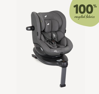 Gray Joie I-Spin 360 spinning car seat facing to the right at a 45 degree angle with the infant insert in and the headrest at the lowest position.
