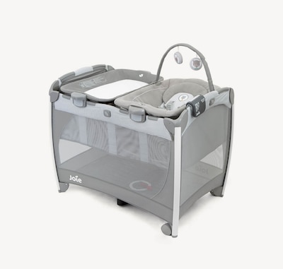 Joie excursion change and bounce travel cot in gray with cartoon imagery at an angle.