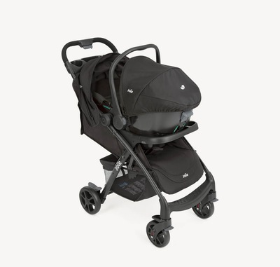 Joie i-Muze lx travel system in black at a right angle with infant carrier attached.