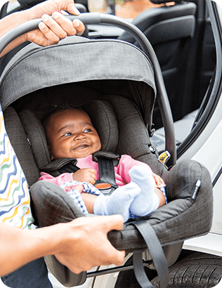 Young infant in the Joie i-Gemm 3 infant carrier car seat